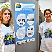 Two people with poster